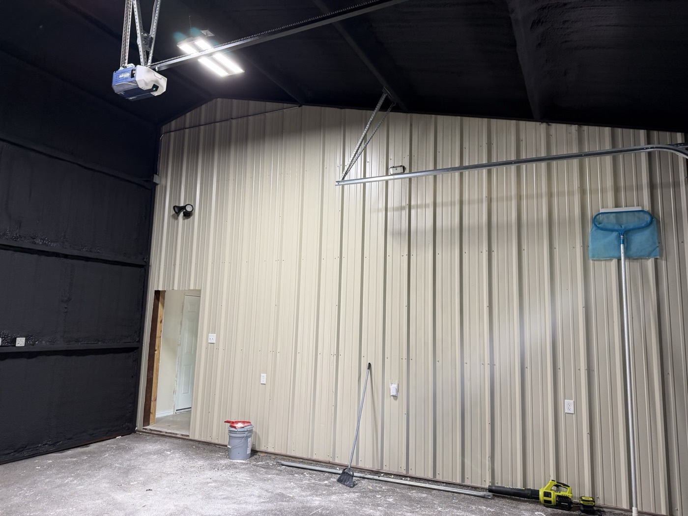 Shop with a black-coated spray foam finish by Armor Insulation