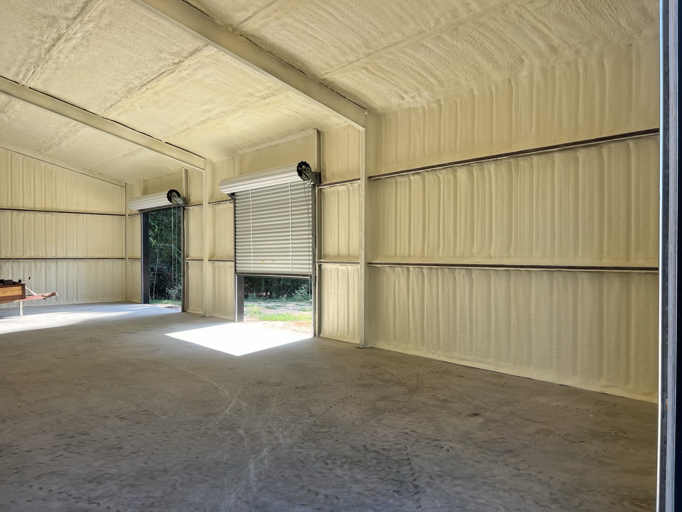 Commercial metal building insulated with spray foam